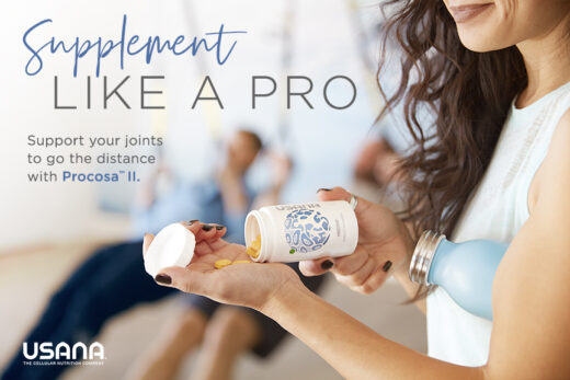 usana procosa bottle in a woman hands wearing a white top shirt